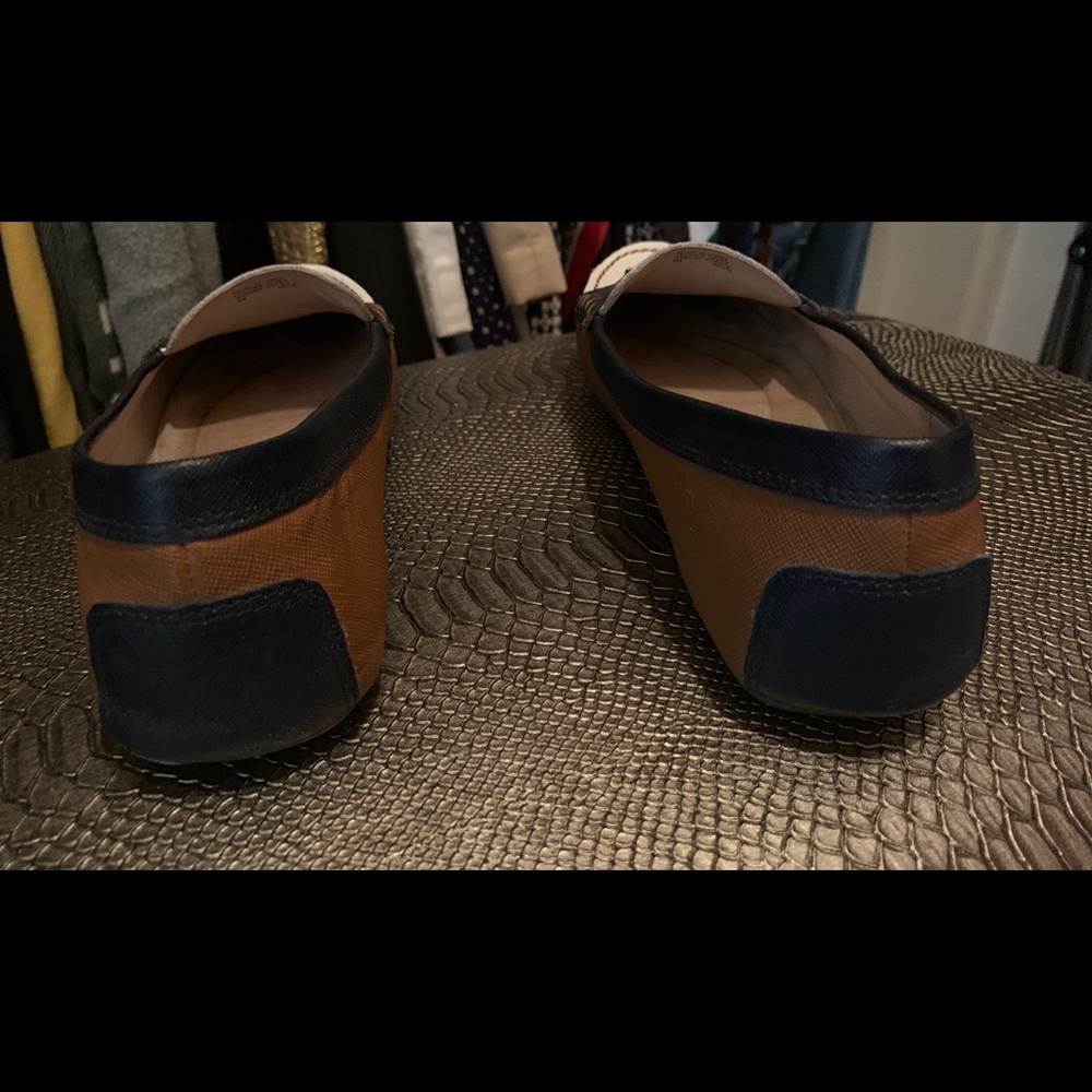 Navy, tan, and white loafer